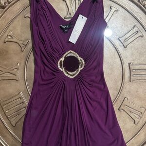 Sky brand sleeveless top with a decorative center embellishment